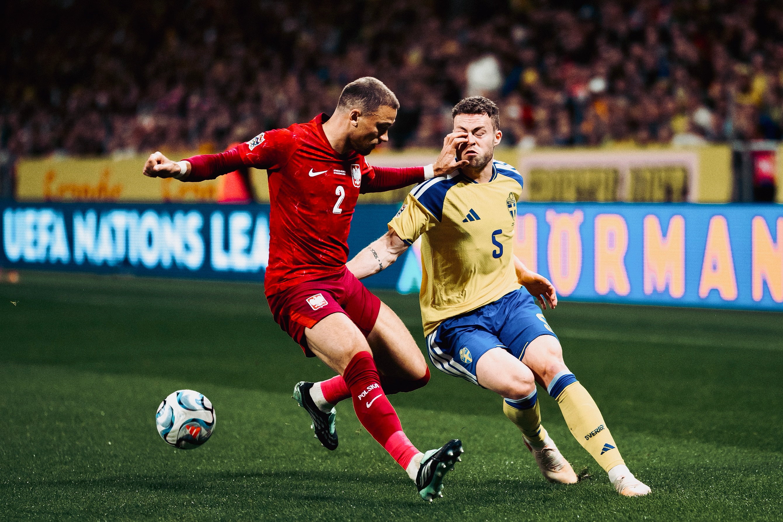 Players contest possession near the touchline.