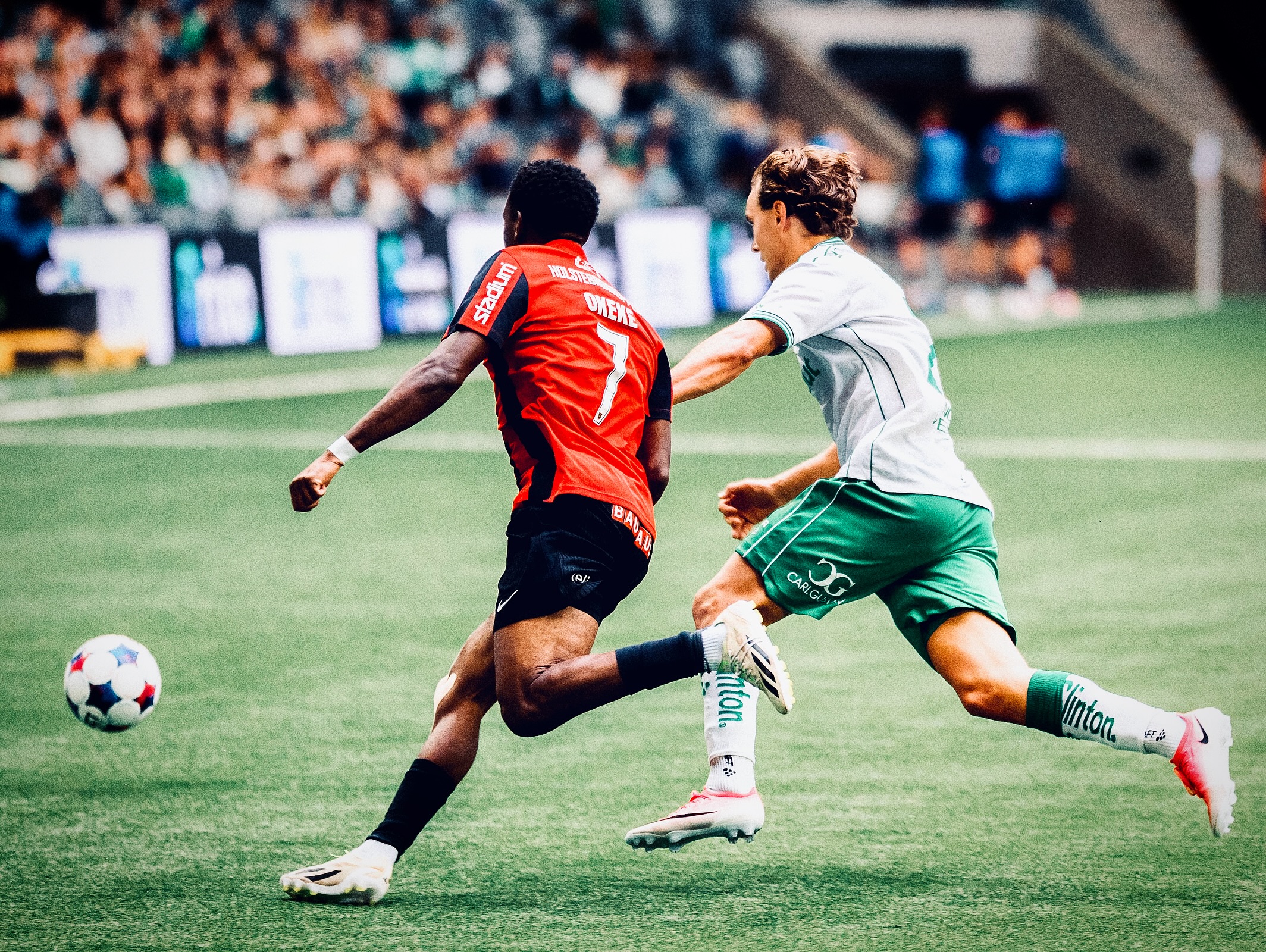 A Brommapojkarna player challenges for possession.