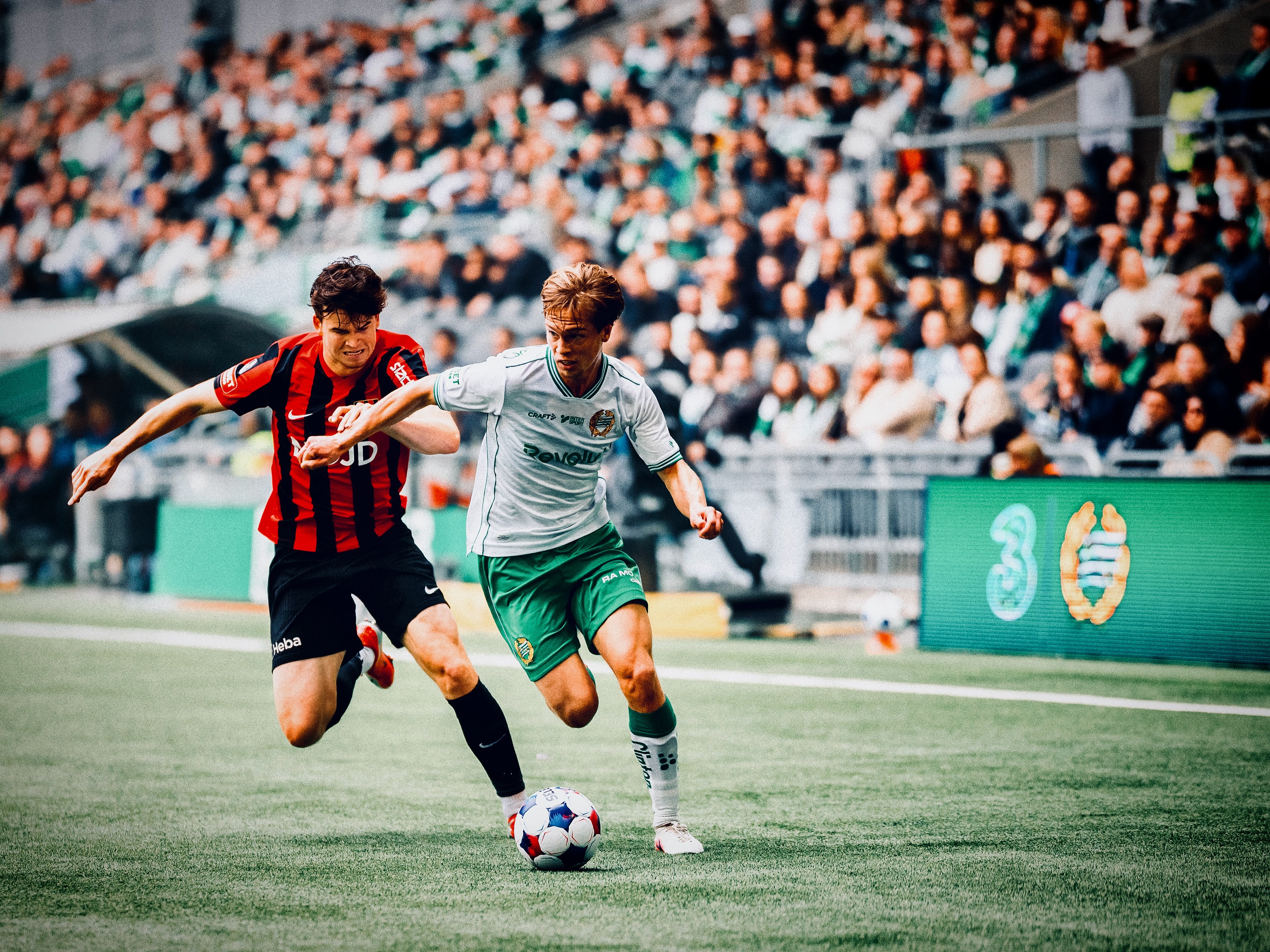 Players challenge for the ball in the Allsvenskan meeting.