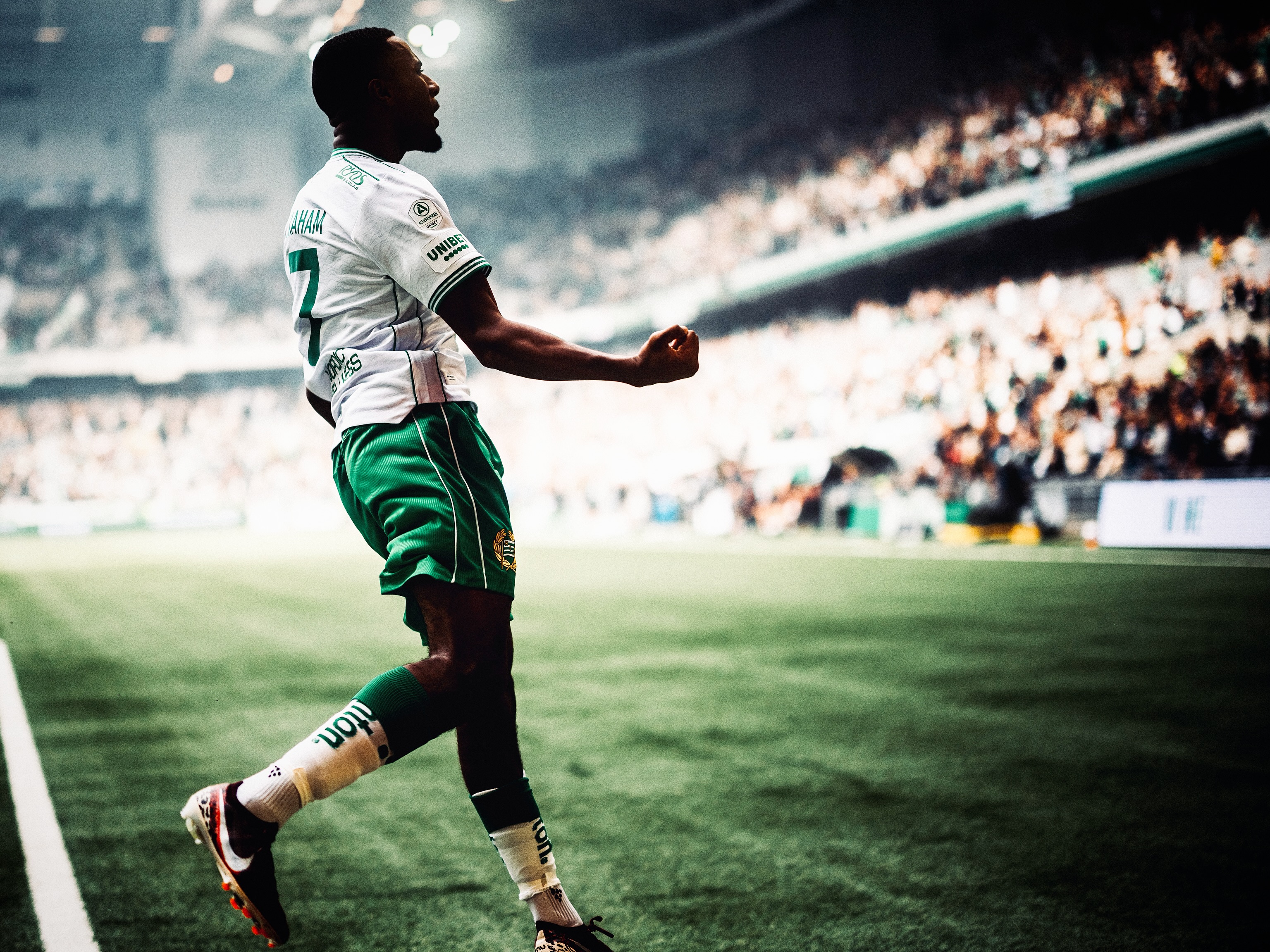 A Hammarby player runs alongside the pitch.