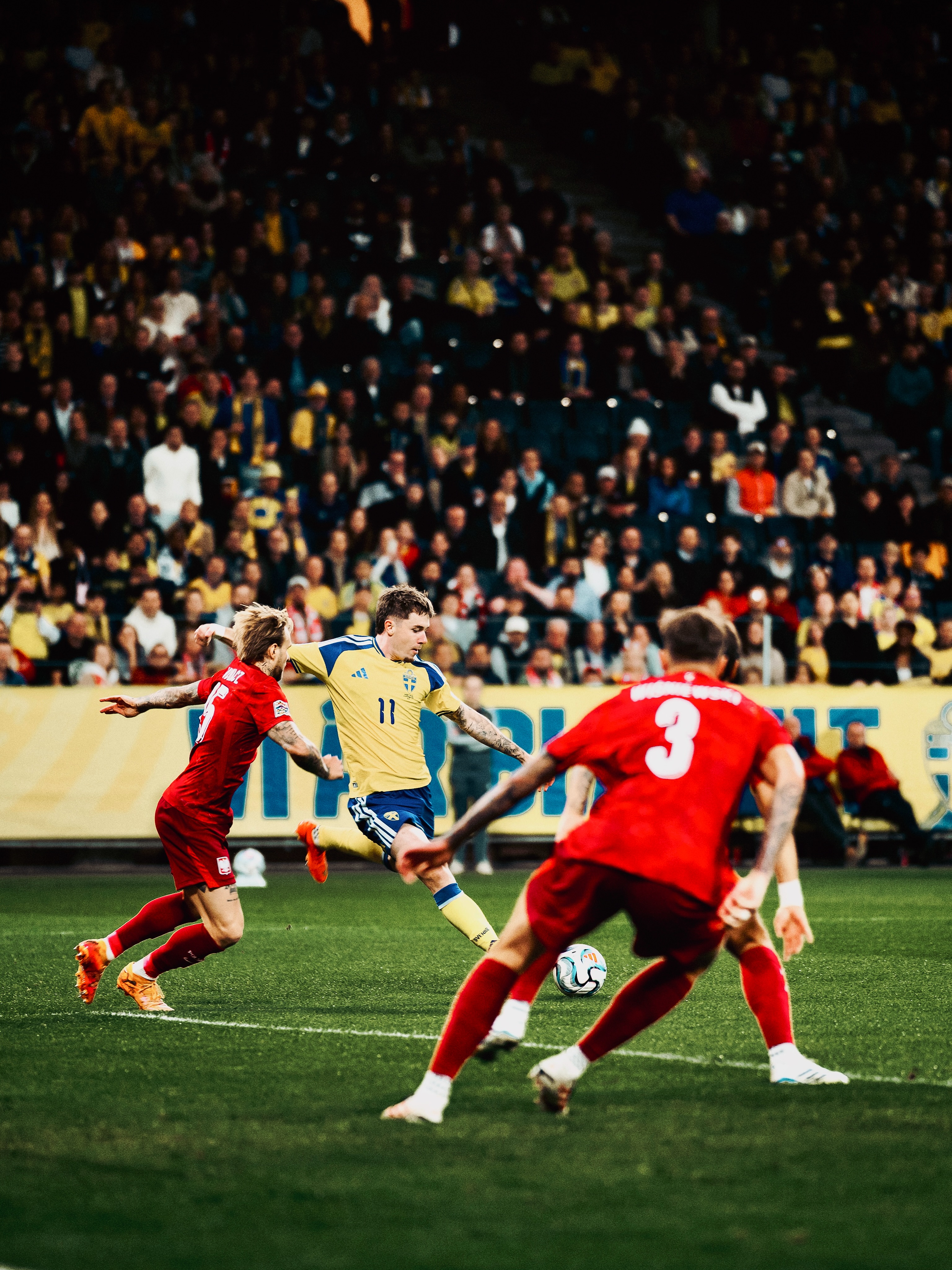 Polish players defend against a Swedish attack.