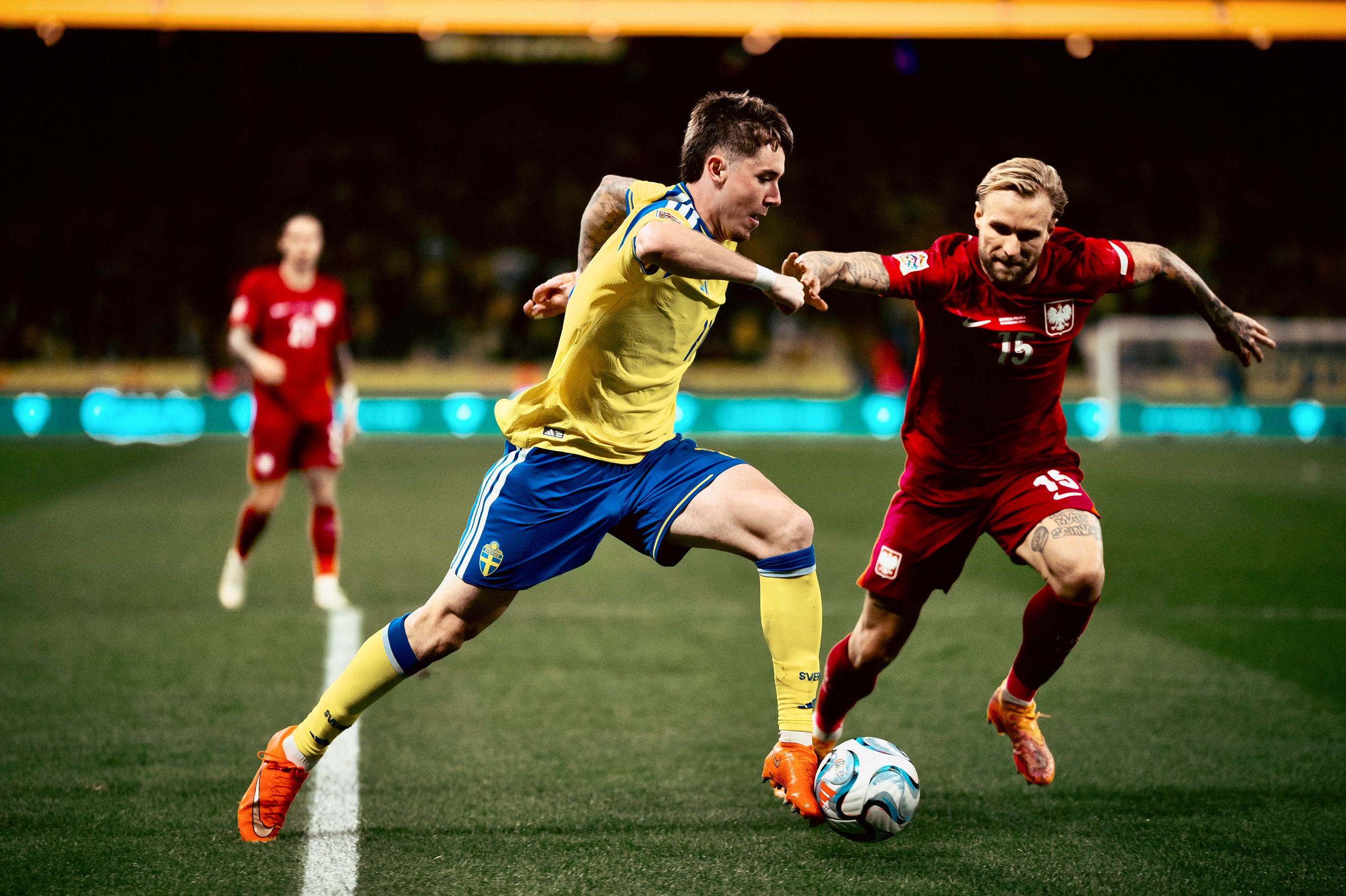 Players challenge for possession.